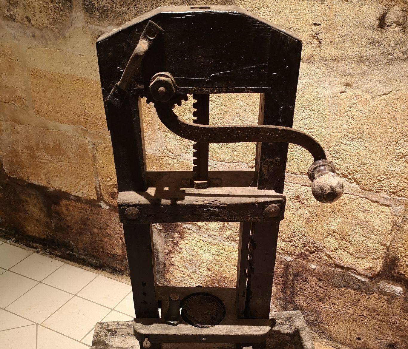 The antique corking machine in the wine cellar