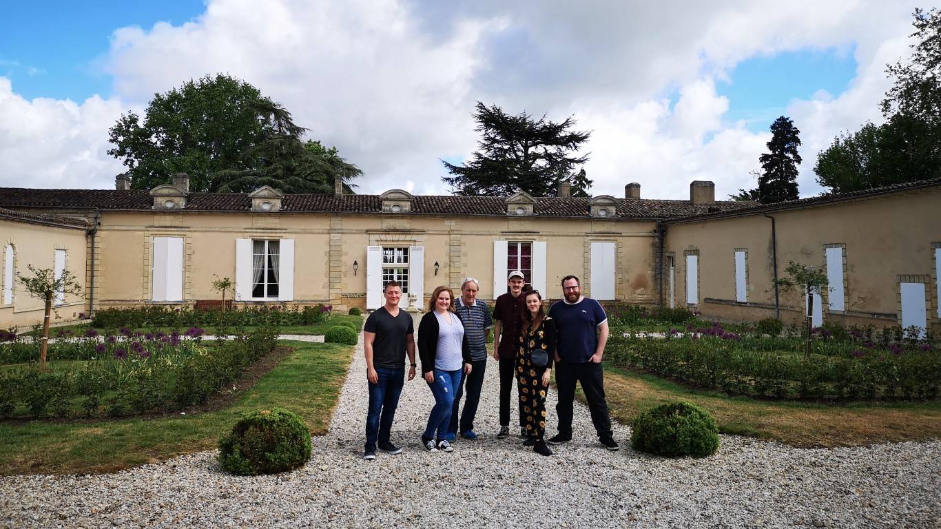 Team Photo outside Chateau Fombrauge, France