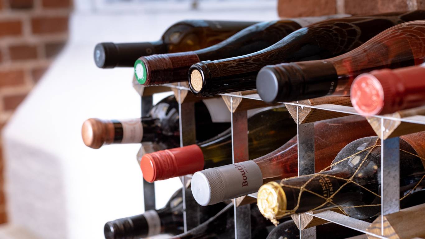 Bottles of wine lying down in a wine rack