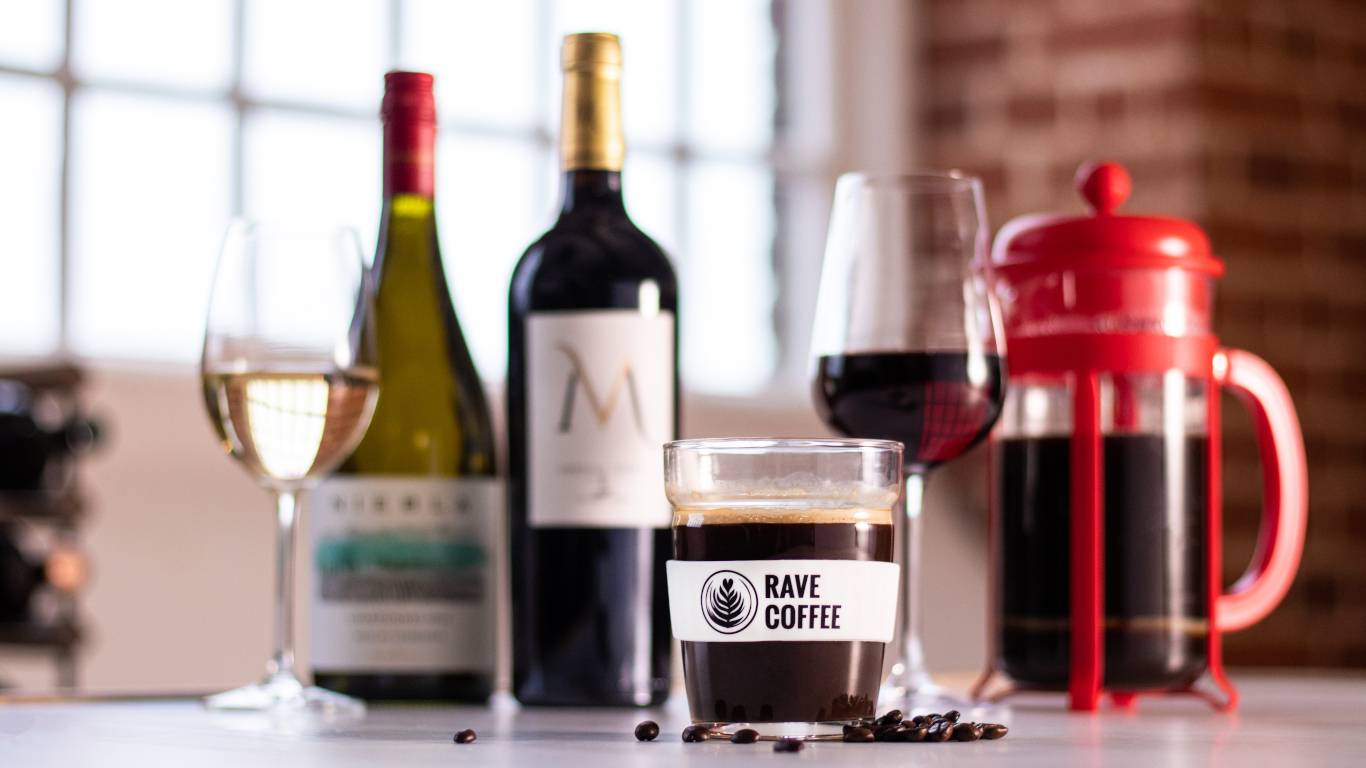 Display of wine and coffee with rave coffee cup featured
