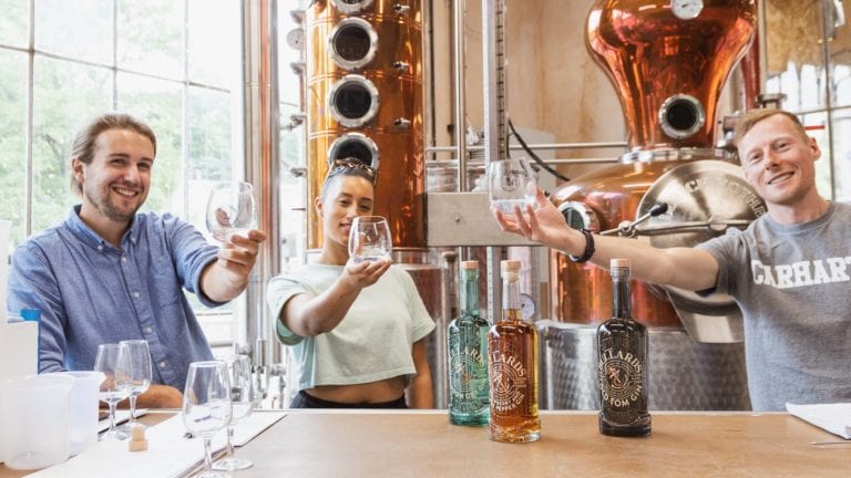 Our Spirits Buyer Dave raising a glass of gin with the team at Bullards Distillery in Norwich