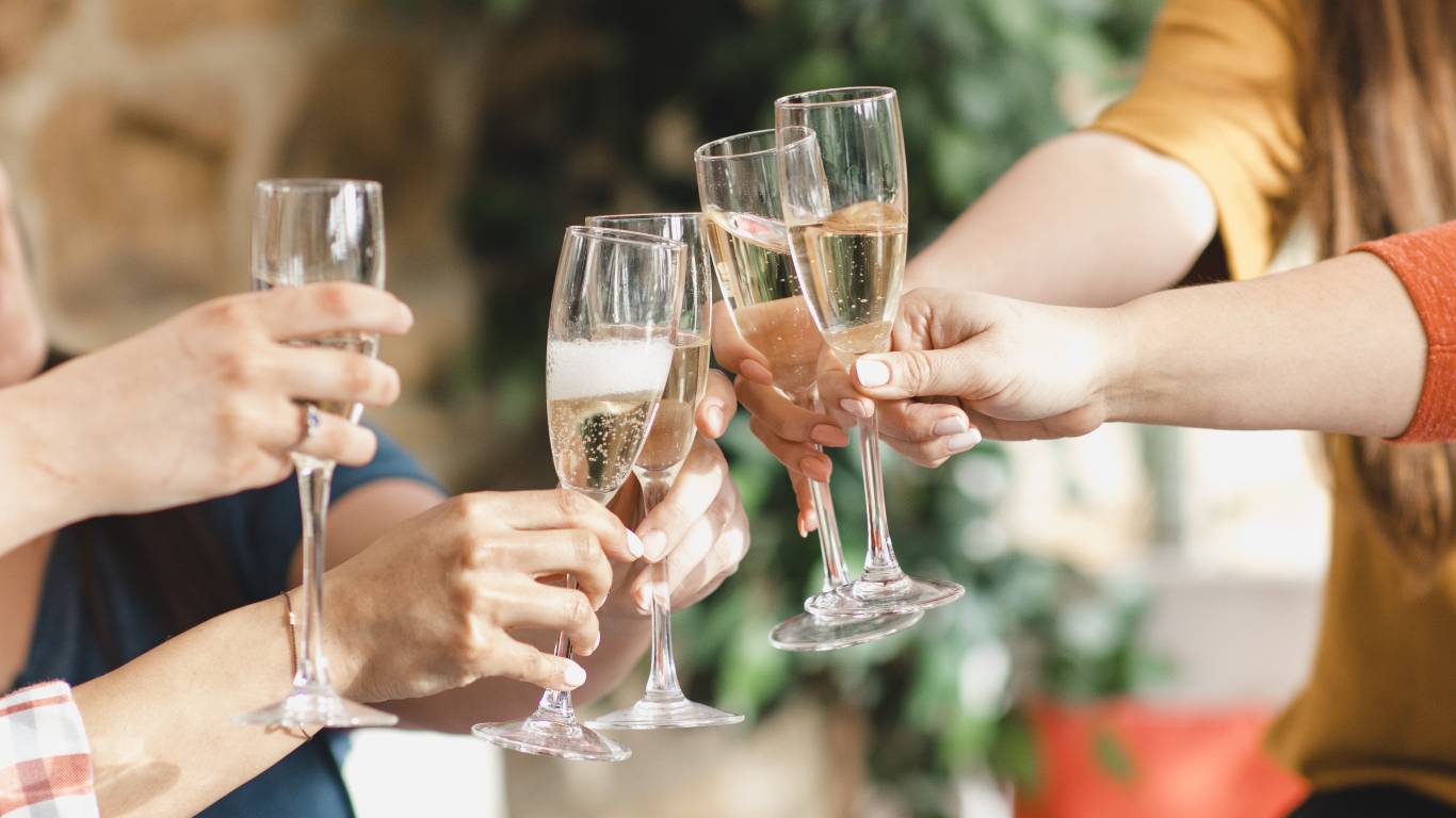 Hands toasting with glasses of prosecco