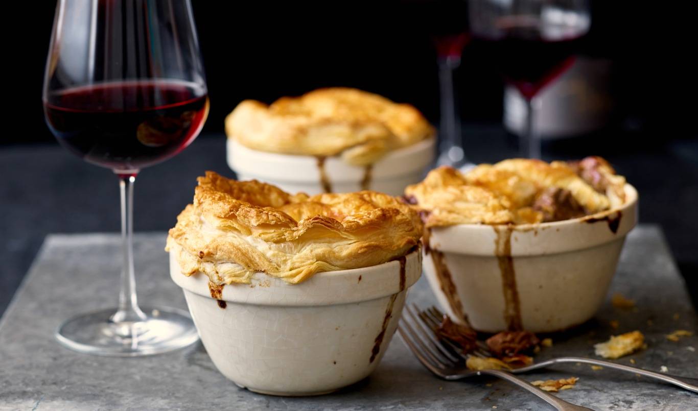 Individual Beef Pies and Glasses of Pinot Noir