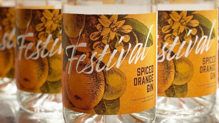 Lineup of Festival Orange Spiced Gin bottles