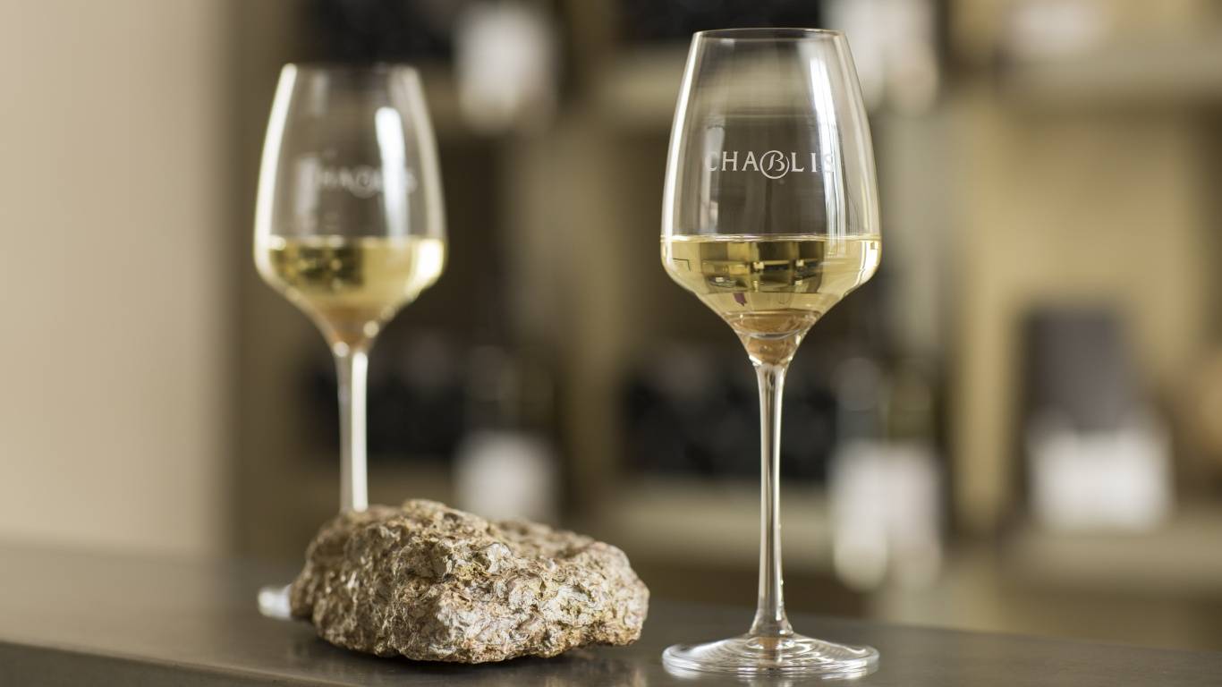 Two glasses of Chablis on a bar