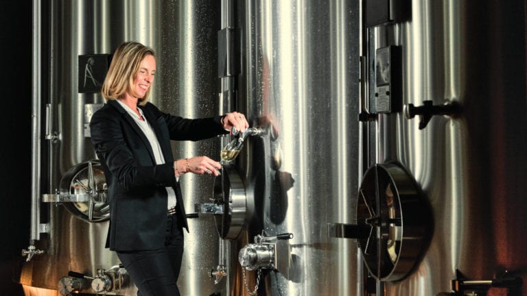 Cellar Master of Ayala Champagne, Caroline Latrive, pouring Champagne from a tank