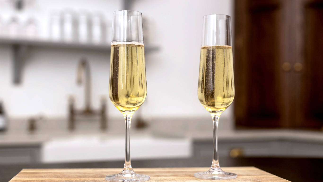 Two glasses of Prosecco on a kitchen worktop