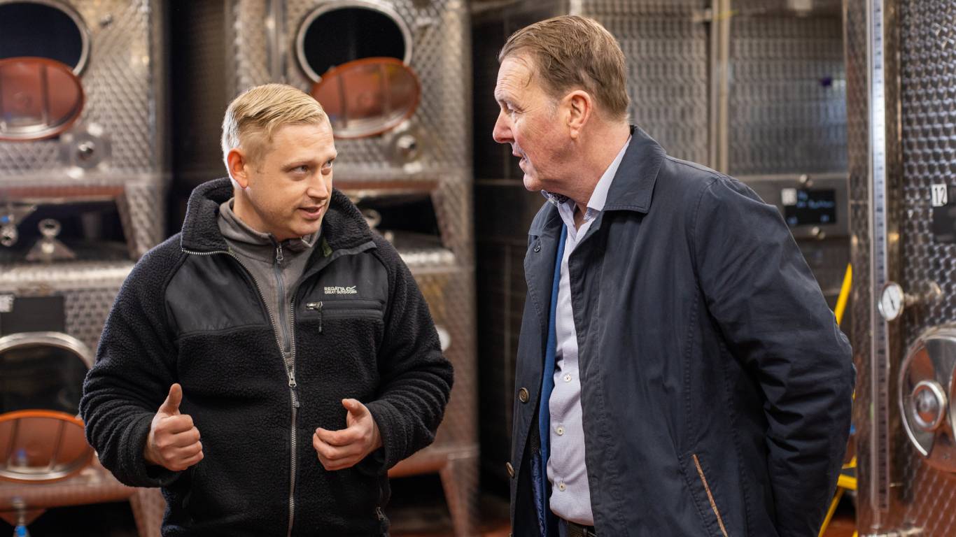 Steve Gillham, Winemaker at New Hall Vineyard, talking to Phil Tufnell in the winery