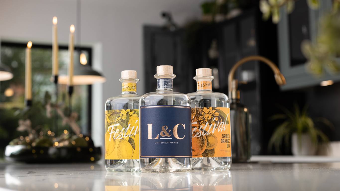Two Festival Gins and an L&C Gin on a festive kitchen worktop