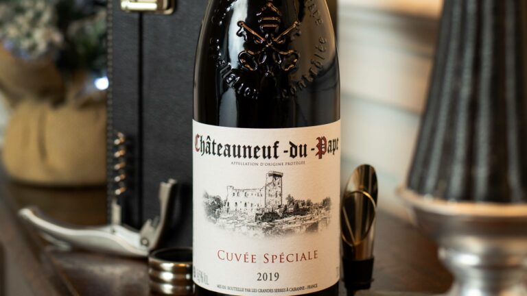 Chateauneuf-du-Pape Cuvee Speciale by a lamp in a living room with wine accessories