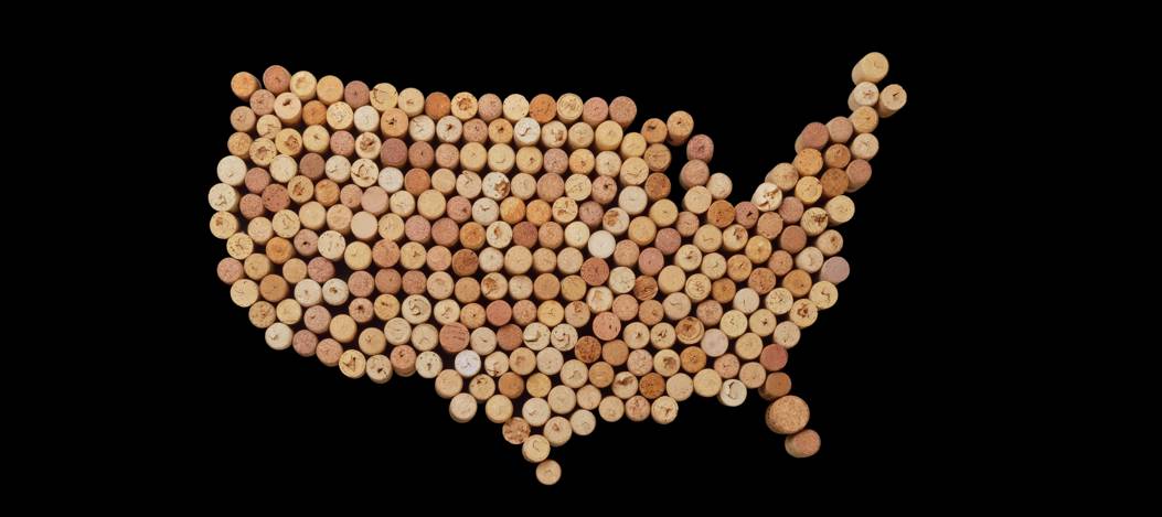 Map of USA made with wine corks on a black background