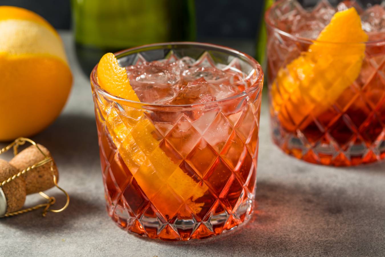 Negroni Sbagliato cocktail in tumber with slice of orange