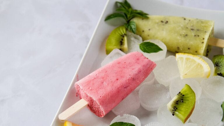 Alcoholic ice lollies with chunks of fruit