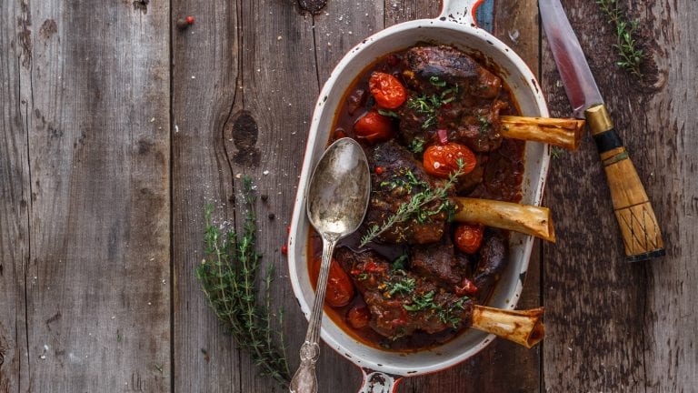 Slow cooked lamb shanks with tomato and herbs